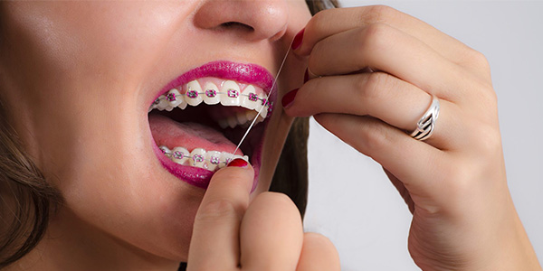 روش استفاده از نخ دندان